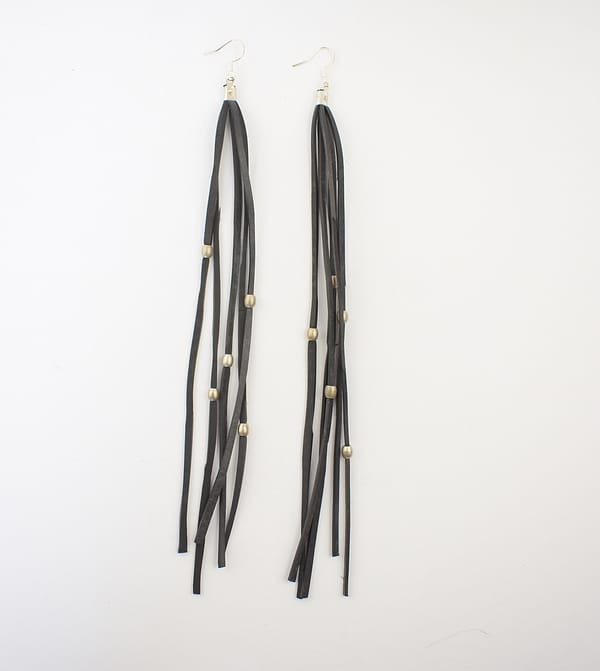 Recyled Jewellery: Long, black Waterfall Earring Plain with small gold beads distributed evenly along their length, showcased as eco-friendly jewelry against a white background. @ Reblack Shop