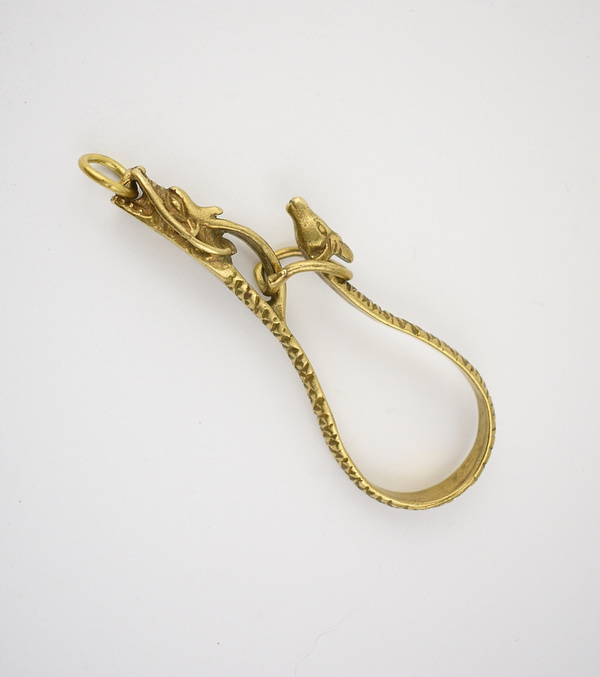 Recyled Jewellery: Dragon Carabiner with a decorative, intricate dolphin design on an eco-friendly white background. @ Reblack Shop
